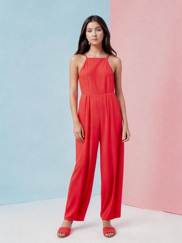 a female model wearing a red jumpsuit