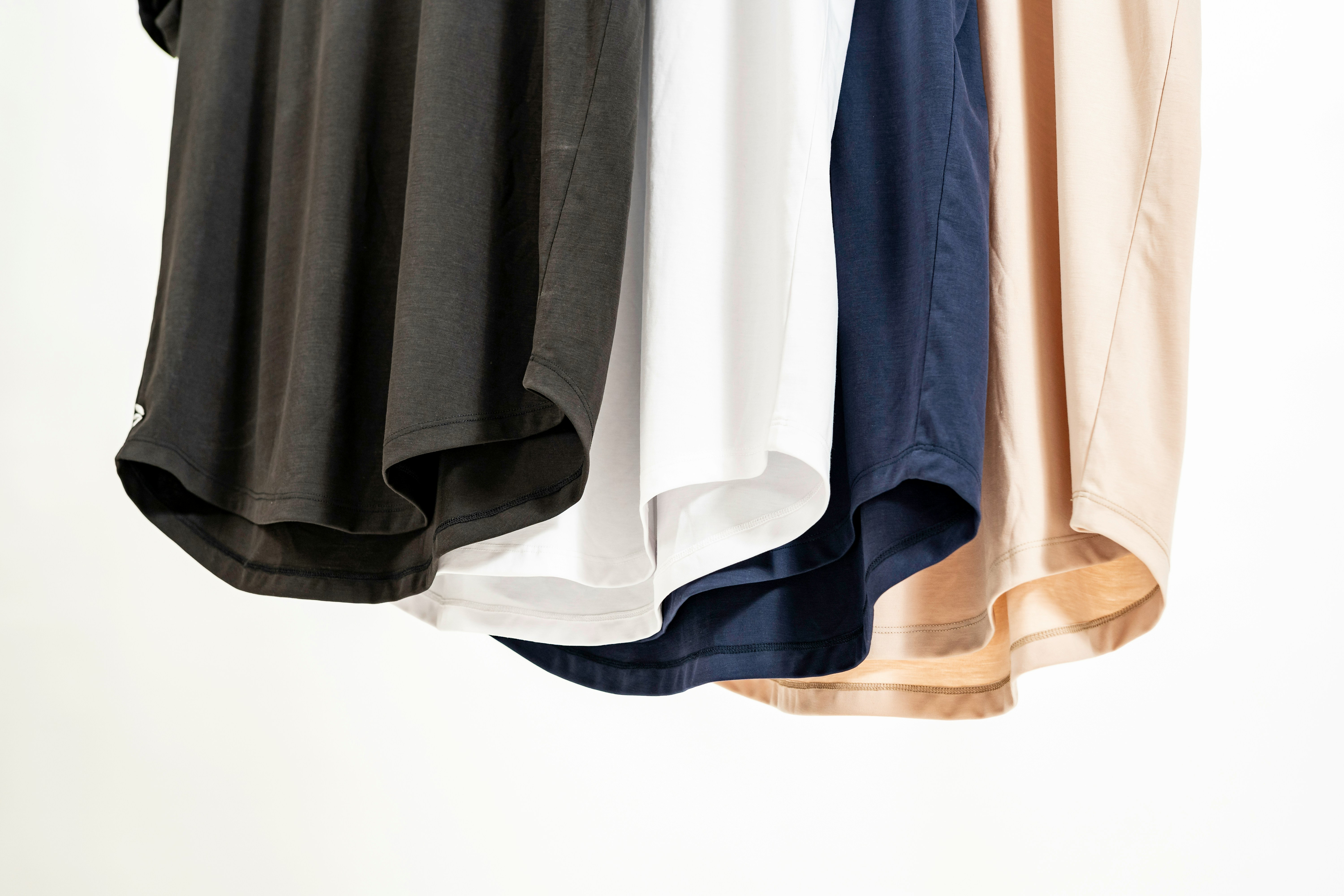 Clean blank T-shirts in neutral colors.