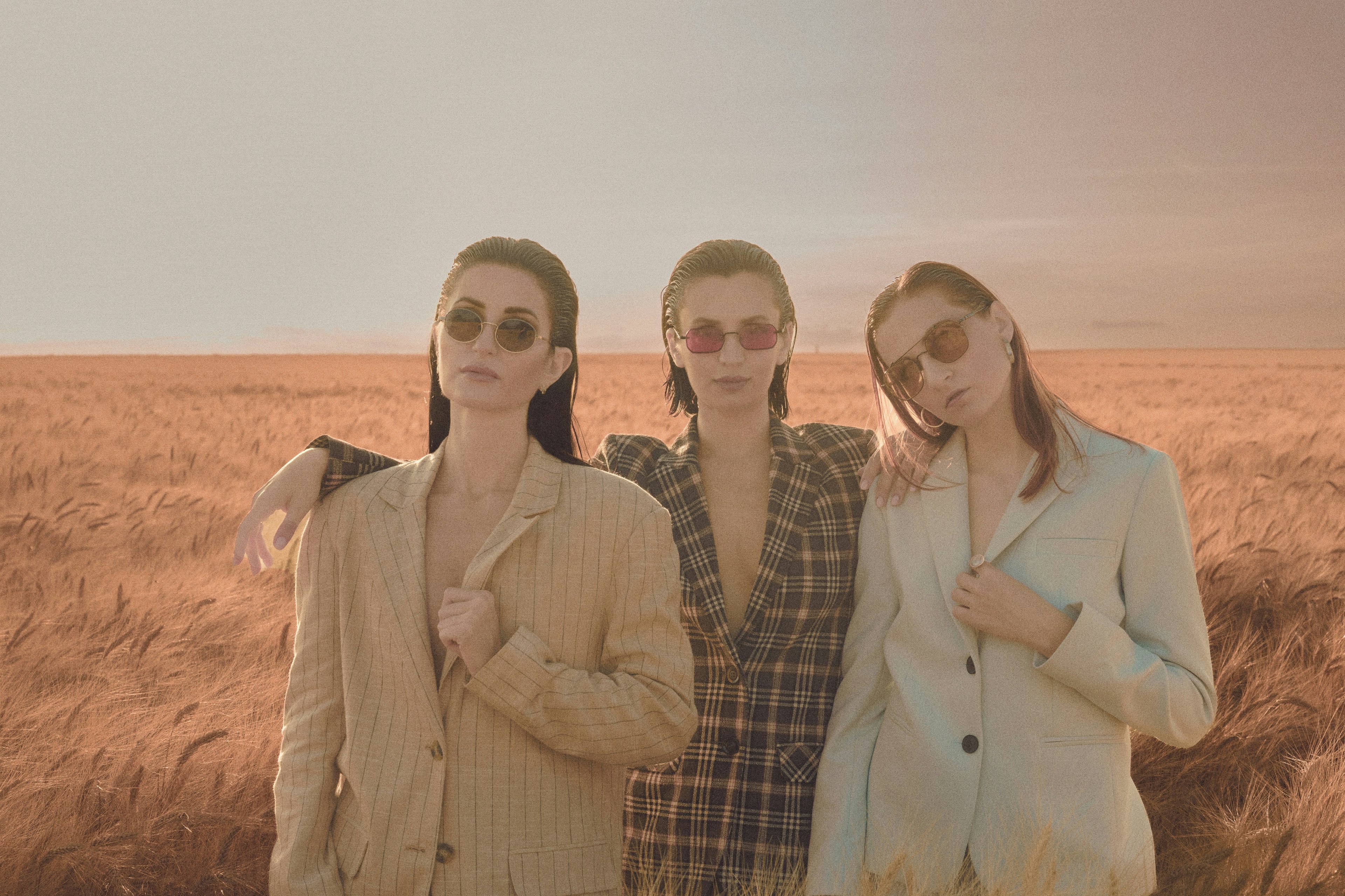 Three models showing a professional and unified brand style.