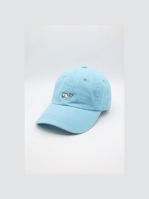 Light blue washed cotton baseball cap with a small embroidered whale logo on the front panel, shown in three-quarter view on a white background.