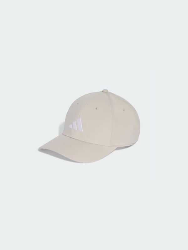 Beige Adidas baseball cap with a white three-stripe logo on the front panel, shown in three-quarter view on a light grey background.