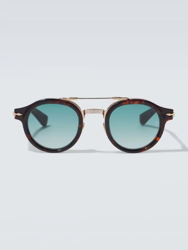 Round tortoiseshell sunglasses with gold accents and gradient blue lenses, displayed front-facing on a light background.