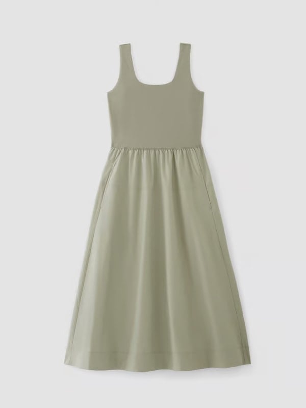 Flat lay of a sleeveless sage green midi dress with a fitted bodice and gathered skirt, displayed on a white background.