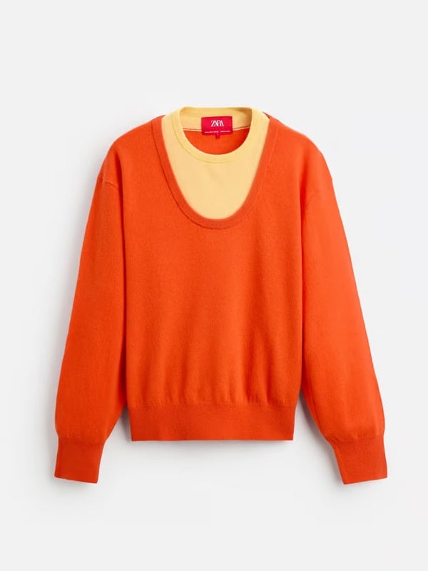 Flat lay of an orange long-sleeve sweater layered over a yellow crew-neck top, featuring a bold color-blocked look, displayed on a white background.