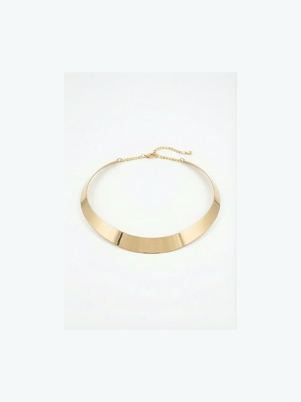 Sleek gold metal collar necklace with an adjustable chain extender and minimal hardware, displayed flat on a light grey background.