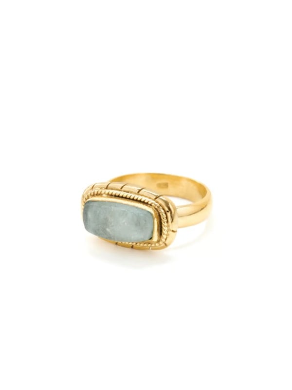 Gold ring with a rectangular cabochon-cut aquamarine stone in a roped bezel setting, displayed in three-quarter view on a white background.