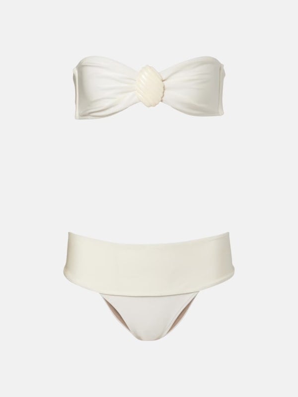 Cream bandeau bikini set with a shell-knot detail at the centre of the top and high-waisted fold-over bottoms, displayed flat on a white background.