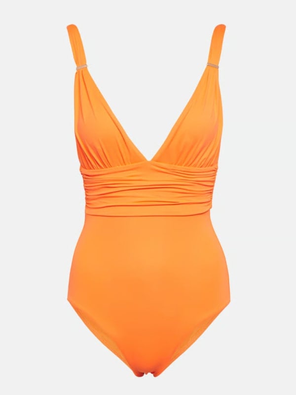 Bright orange one-piece swimsuit with a deep V-neckline, ruched bandeau waist, and silver bar hardware on the straps, displayed flat on a white background.